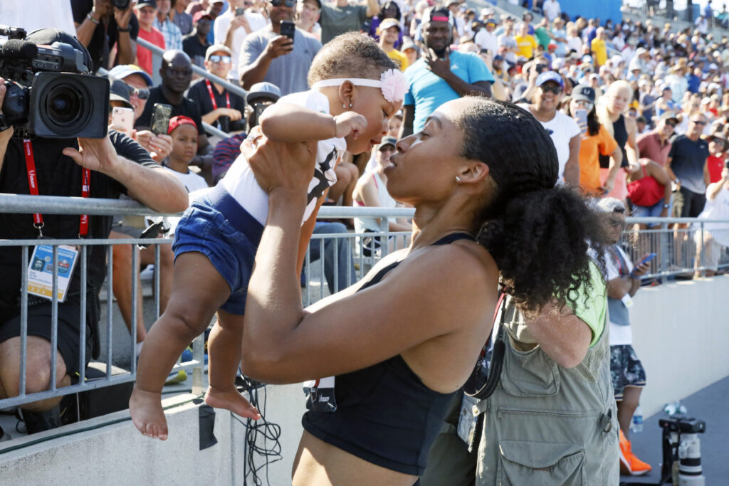In this July 27, 2019, file photo, Allyson Felix holds her daughter, Camryn, after running the women's 400-meter dash final at the U.S. Championships athletics meet in Des Moines, Iowa. Photo credit: Charlie Neibergall, The Associated Press