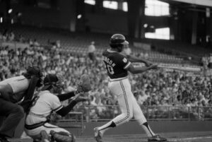 Cleveland Indians player-manager Frank Robinson slugs his first home run in his first at bat against the California Angles on July 7,1976, in Anaheim, California. Photo credit: The Associated Press