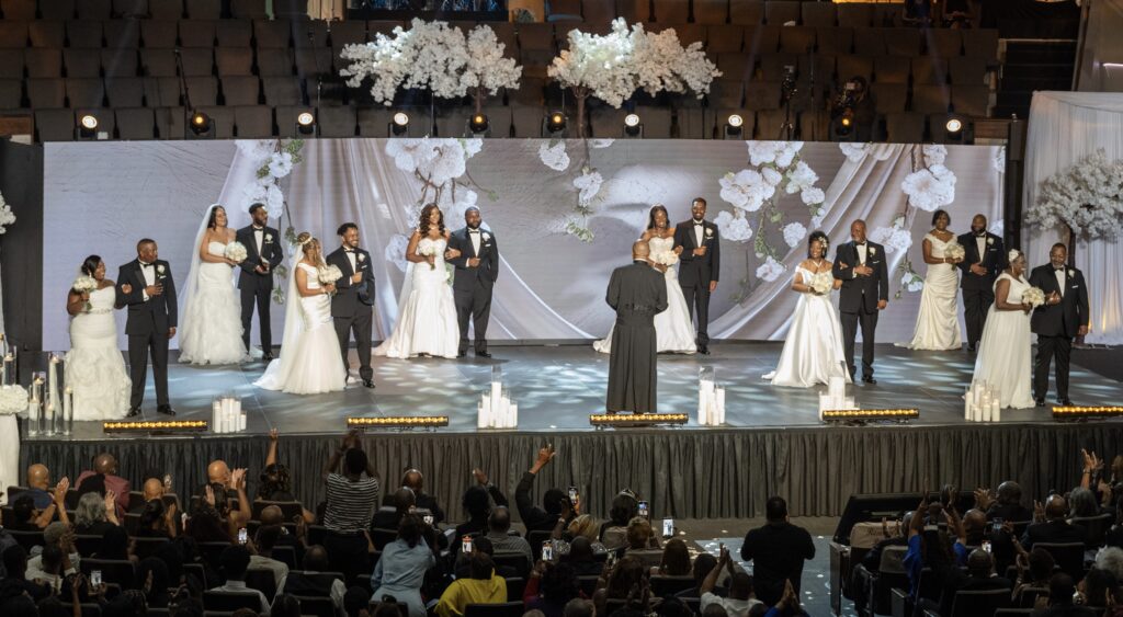 Couples on stage at the Grand Wedding, Concord Church, Dallas, on Saturday, Sept. 20, 2025. Photo credit: Concord Technologies