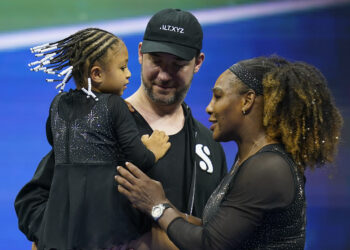 Serena Williams talks with her daughter, Olympia, and husband, Alexis Ohanian, after defeating Danka Kovinic, of Montenegro, during the the U.S. Open tennis championships on Aug. 29, 2022, in New York. Photo credit: Charles Krupa, The Associated Press