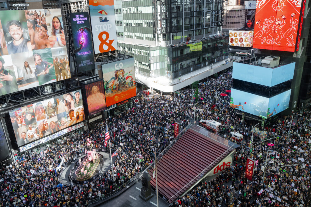 Thousands of protesters fill Times Square during a "No Kings" protest on Saturday, Oct. 18, 2025, in New York. Photo credit: Olga Fedorova, The Associated Press