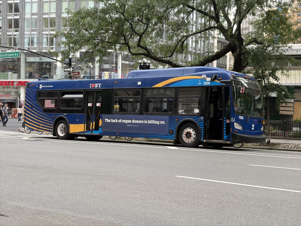 An advertisement by LiveOnNY, a Queens, New York-based nonprofit that encourages organ donation, is seen on the exterior of a New York City bus. Photo credit: Black News & Views