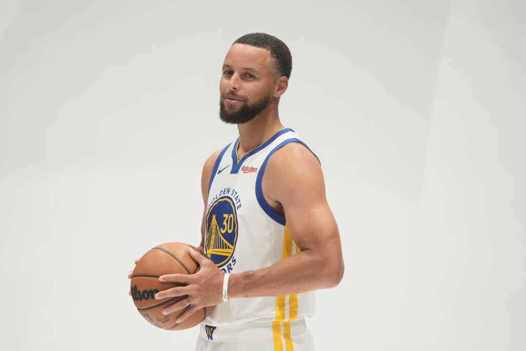 Golden State Warriors guard Stephen Curry poses for photos during the NBA basketball team's media day in San Francisco, Monday, Sept. 29, 2025. Photo credit: Jeff Chiu, The Associated Press