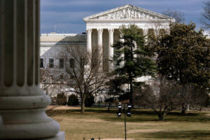 The Supreme Court is seen in the distance, framed through columns of the U.S. Senate at the Capitol in Washington, D.C., on Feb. 20, 2025. Photo credit: J. Scott Applewhite, The Associated Press