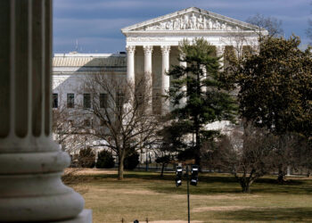 The Supreme Court is seen in the distance, framed through columns of the U.S. Senate at the Capitol in Washington, D.C., on Feb. 20, 2025. Photo credit: J. Scott Applewhite, The Associated Press
