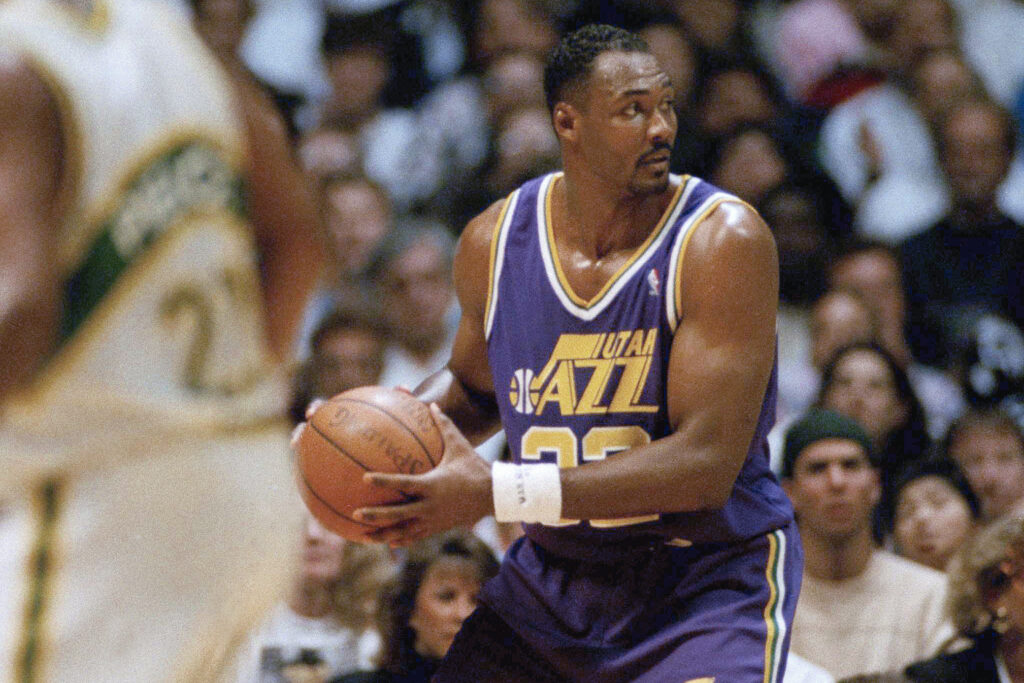 Karl Malone, then of the Utah Jazz, handles the ball during NBA Western Conference semifinal game against the SuperSonics on May 11, 1992, in Seattle, Washington. Photo credit: Gary Stewart, The Associated Press