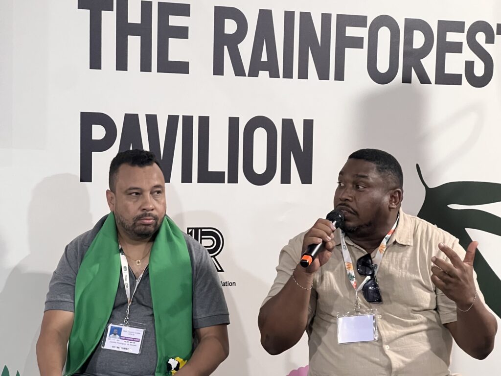 Quilombo leaders Denildo Rodrigues de Moraes and Davi Pereira Jr. present the results of a geographical study of quilombos in the Amazon during COPS30 in Belém, Brazil, in November 2025. Photo credit: Kiratiana Freelon, Black News & Views