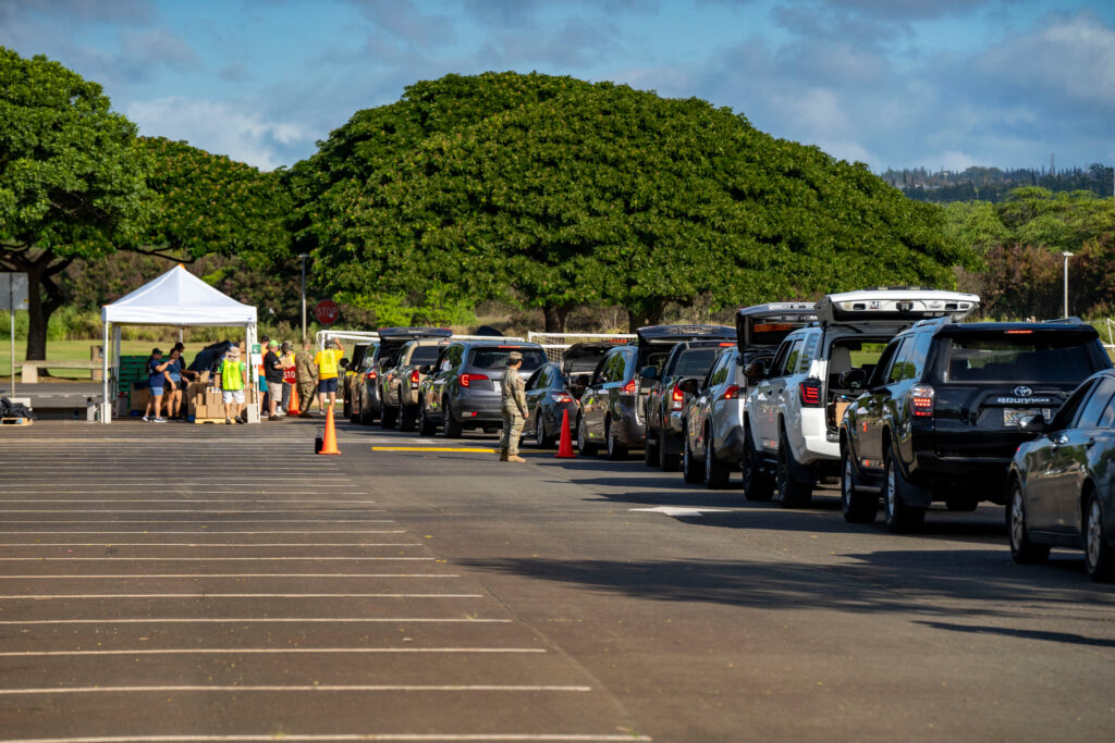 Cars line up for a Hawaii Foodbank pop-up food distribution at Waipio Soccer Complex, Monday, Nov. 10, 2025, in Waipahu, Hawaii. Photo credit: Mengshin Lin, The Associated Press