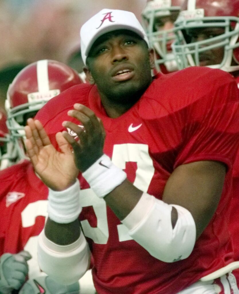 Then-Alabama running back Shaun Alexander applauds a Crimson Tide score in a game against Southern Mississippi at Bryant-Denny Stadium in Tuscaloosa, Alabama, on Oct. 30, 1999. Photo credit: Dave Martin, The Associated Press