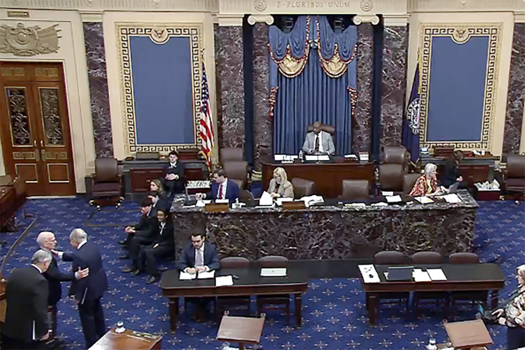 In this image from video provided by Senate TV, Senate Majority Leader Chuck Schumer, D-N.Y., third from left, walks off after speaking on the Senate floor at the Capitol in Washington on March 14, 2024. Photo courtesy Senate TV via The Associated Press